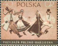 Two Couples Dancing in Polish and Russian Folk Costumes