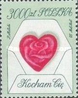 Rose flower in a symbolic heart on an envelope