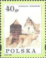 City walls with a tower and a Renaissance building
