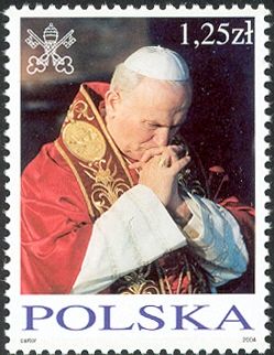 Wearing red stole, praying