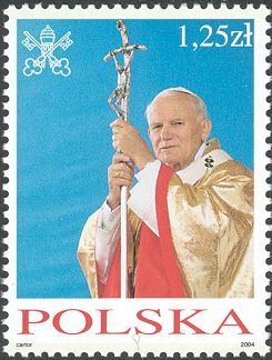 Wearing gold stole, holding crucifix