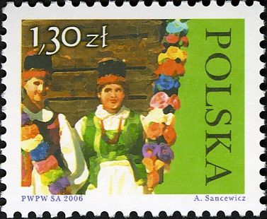 Women holding paper flower palms