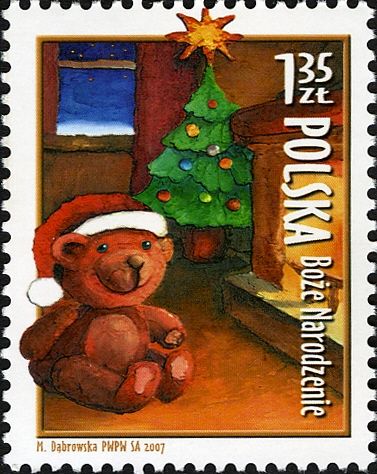 Teddy Bear beside Christmas tree