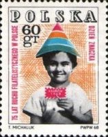 Child holding symbolic stamp