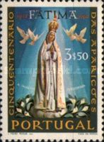 Statue of the Pilgrim Virgin, with lilies and doves