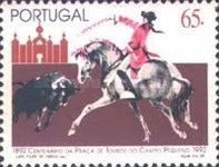 Bull charging at horse