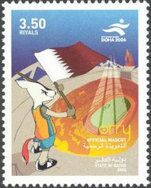 Orry with flag of Qatar over the Khalifa Stadium
