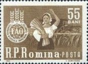 Country woman with sheaf of grain & combine