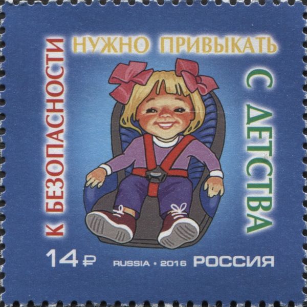 Girl Strapped into Child Seat