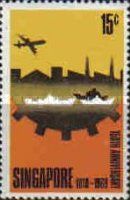 Aircraft over silhouette of Singapore docks