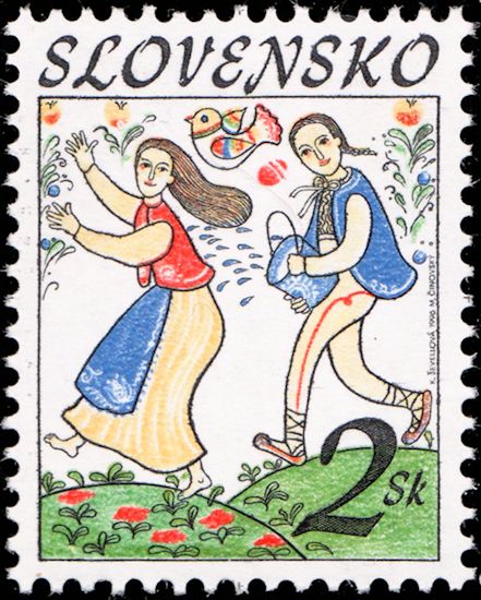 Young man throwing water to a woman