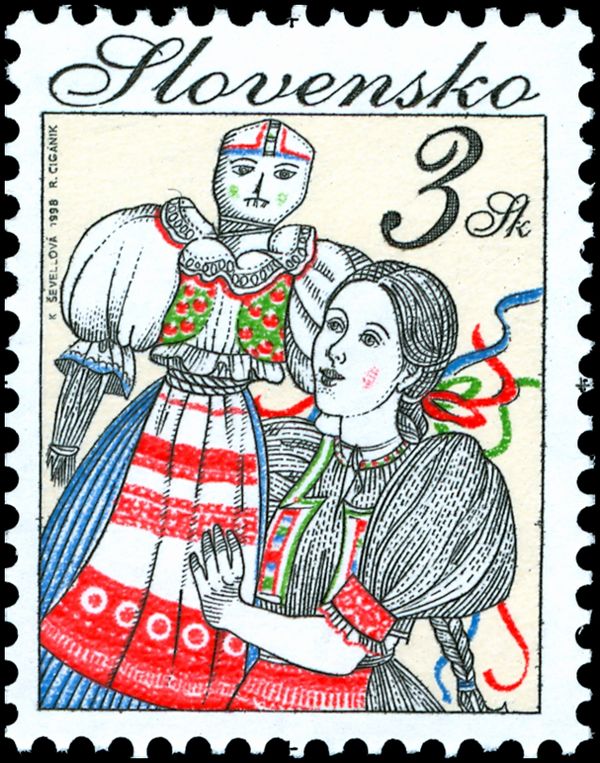 Woman holding a folk figure