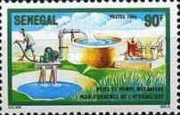 Man with Hose and Cattle Water Trough