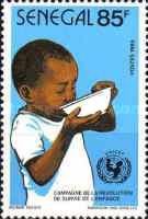 Boy Drinking from Water Bowl