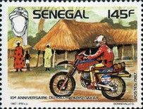 Motor Cyclist and Village