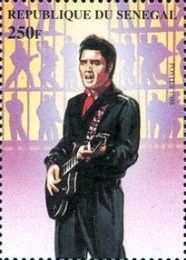 Elvis with Dark Suit and Guitar against Shadow Figures