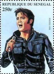 Elvis in Frontal View Singing to Handheld Microphone