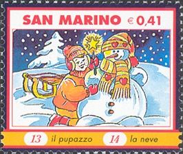 Boy, sled and snowman