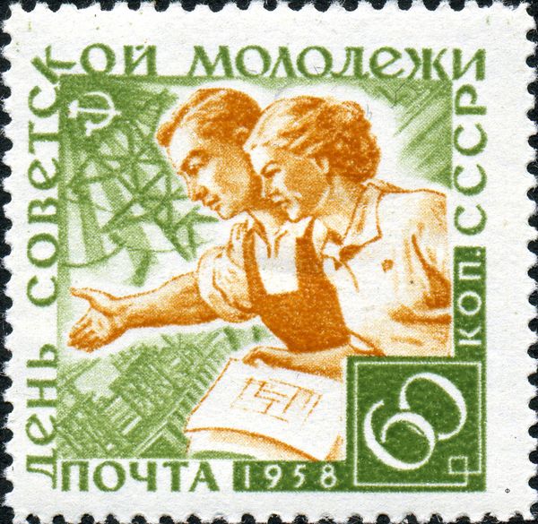 Young Couple in Front of Power Plant