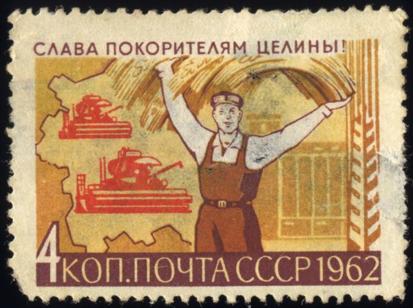 Farmer Holding Grain, Combine Harvesters on Map