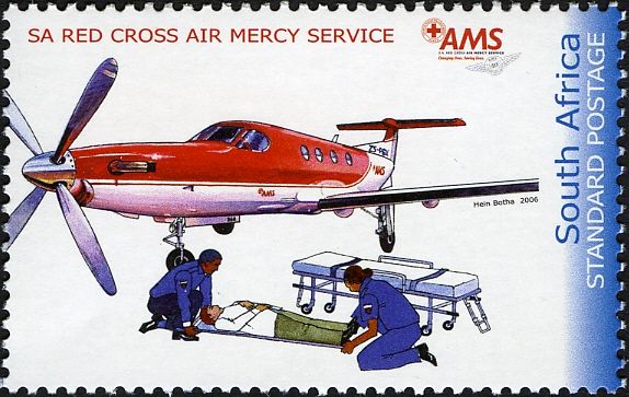 Airplane, paramedics tending to man on stretcher