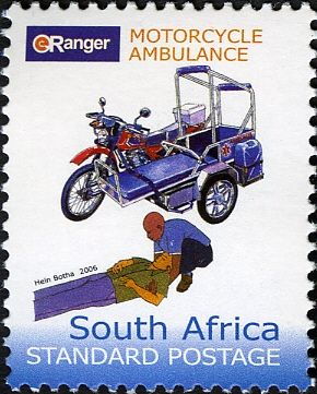 Motorcycle ambulance, paramedic assisting man