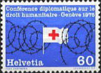 Red Cross Flag Surrounded by Barbed Wire