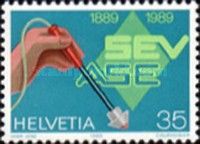 Hand with Testing Device & SEV Badge