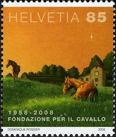 Two Horses (Equus ferus caballus) and Building