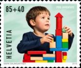 Child Playing with Toy Blocks