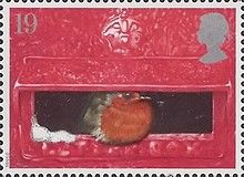 European Robin (Erithacus rubecula) in Mouth of Pillar Box