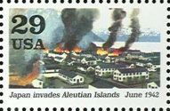 Dutch harbor buildings on fire (Japan invades Aleutian Islan