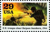 Soldier firing flamethrower (US troops clear Saipan bunkers)