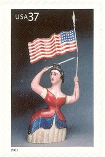 Carving of Woman with Flag & Sword