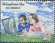 Man and woman in field with computer
