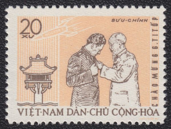 Pres. Ho Chi Minh pinning medal on Titov