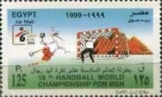 Mascot with ball, goalie, pyramids