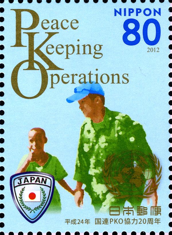 A PKO personnel with a boy
