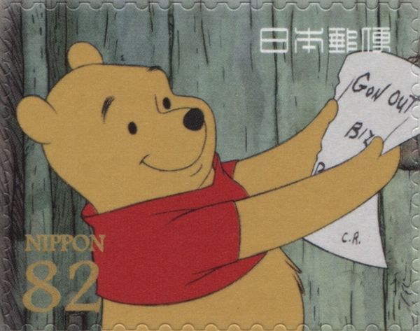 Pooh Hanging a Sign