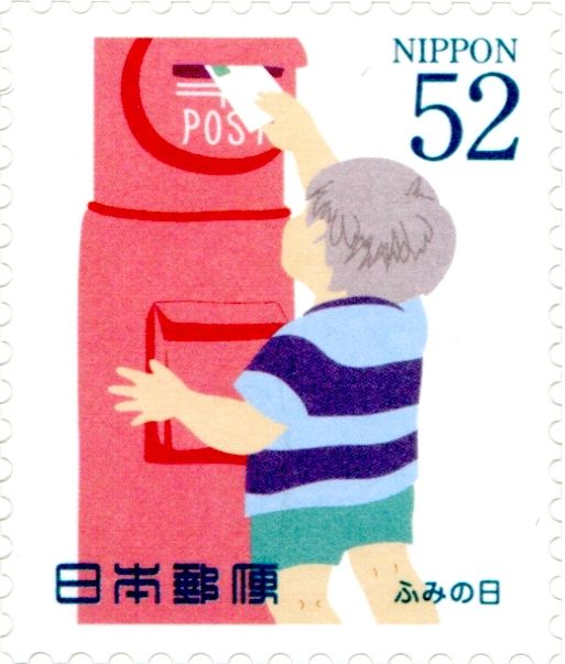 Boy Putting Letter in Postbox
