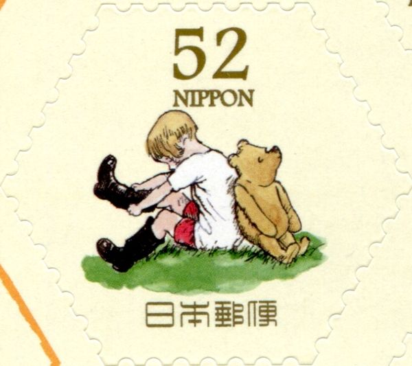 Winnie the Pooh beside Christopher Robin