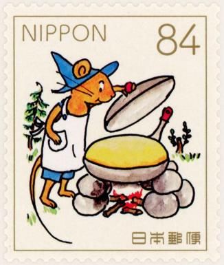 Guri Cooking over a Campfire