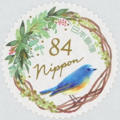 Red-flanked Bluetail ( Tarsiger cyanurus) and Green Wreath