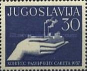 Hand with a Model of a Factory