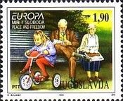 Children at play beside two old