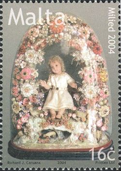Wax Bambino inside glass dome