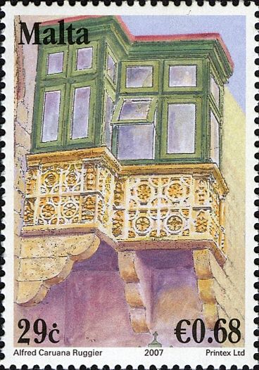 Carved stone balcony with glazed timber enclosure, Gozo