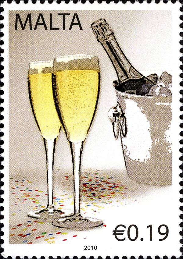 Two glasses of champagne and bottle in ice bucket