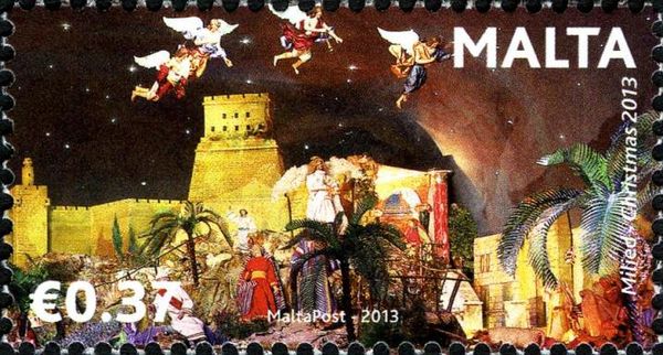 Crib scene with palm trees and angels flying over city walls