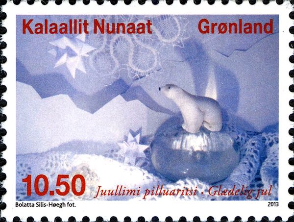 Polar bear on glass sphere, paper stars